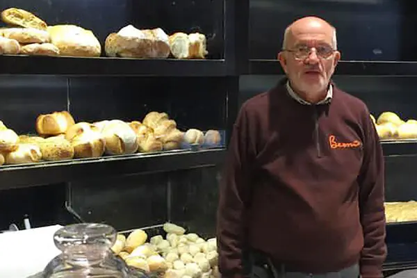 A man of many careers, Gianni Bernardinello settled down as a baker. A sign outside his shop over free baked goods read,&nbsp;“To give a hand to those in need, help yourself and think of others too.”